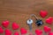 House key with home keyring decorated with mini heart on rusty wood background