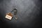 House key with home keyring on rusty wood background