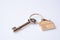 House key ring with antique key on white background. Property investment. Home finance concept