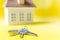 House keys on yellow background.Family dream house, apartment, housing.