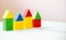 House made of old cubes. Wooden colorful building blocks. Vintage childrens toys. the concept of building a house, apartments for