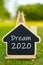 House model on stand with dream 2020 text on it.