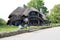 House with mushroom cap style roof in Charlevoix Michigan