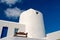 House in Mykonos, Greece. Whitewashed building on sunny blue sky. Typical house architecture and design. Summer vacation