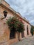 house near flower tree and lantern, uruguay, colonia del sacramento