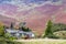 House nestling against a background of a steep fell side