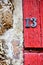 House number 13 on antique rustic wall, old, rusty metal numbers