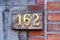 House Number 162 sign