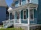 House with old fashioned wood spindle railing on porch