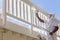 House Painter Spray Painting A Deck of A Home