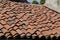 House with pitched roofs with brick tiles.