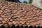 House with pitched roofs with brick tiles.