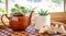 House plants grown in recycled mug and tea pot displayed in sunny window