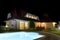 House and pool at night