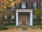 House with portico entrance and vines