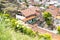 House with red tiled roof and carved wooden balconies in old town Tbilisi, top view