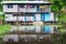 House Reflected in Amazon River