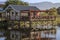 House reflected in scenic lake