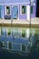 House and reflection in a canal, Burano, Italy