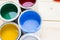 House renovation concept, colorfull paint cans on wooden background