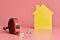 House renovation funny concept. Metal tape measure and other repair items. Home repair and redecorated concept. Yellow house