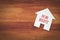 House for rent symbol on wood