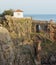 The house on the rocky embankment at a cave A mout