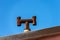 House roof with chimney made with rusty pipes - Italy