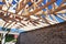 House roofing construction with wooden trusses. Timber roof trusses building.