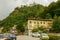 House and Sacred mountain sanctuary on background, Varallo Sesia village, Piedmont, Italy