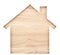 House shaped paper cutout on natural wood lumber.