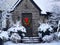 House with snow covered bushes and Christmas decoration on front door