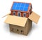 House with solar batteries in cardboard box