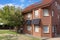 House with solar panels attached to facade brick wall