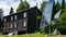 house with solar panels in summer and wood heating in winter, green energy