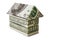 The house is stacked of dollar bills on a white isolated background. Element for design. Buying and selling housing. Mortgage.