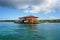 House on stilts over water of the Caribbean sea