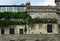 House with stone vine tree and balcony with iron handrail and real vine tree. Santiago de Compostela, Spain. Quintana Square.