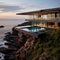 A house suspended on a cliff above the Mediterranean Sea