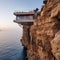 A house suspended on a cliff above the Mediterranean Sea
