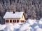 House in a swiss winter landscape