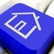 House Symbol Computer Key In Blue Showing Real Estate Or Rentals