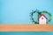 House toy on wooden shelf home decoration, New family house buying concept, Creative blue wall with clean copy space for design