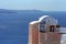 House in traditional Cycladic architectural style, on the edge of the volcano caldera of Santorini island.