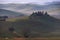 House in Tuscany in the morning fog