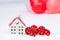 House and two hearts in snow - Valentine`s Day, love in home. Couple housing, real estate, rent, mortgage, relocation. Comfort an