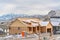 House under construction in Utah Valley against snowy mountain and cloudy sky