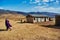 house and walking Masai in Crater Highlands Tanzania mountains