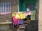 house wife Woman at balcony drying clean cloth in the sun