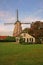 House and windmill in the Netherlands vertical